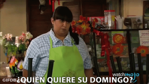 Woman In Green Apron Says Quien Quiere Su Domingo In Restaurant GIF