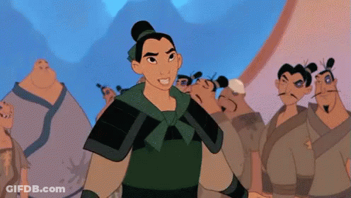 Woman In Green Armor Standing Before Group Of Men GIF