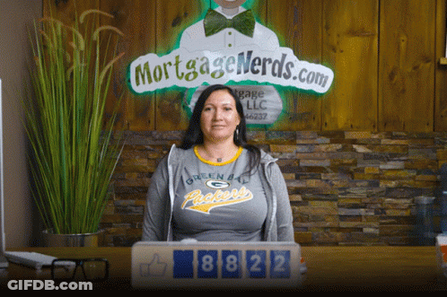 Woman In Green Bay Packers Shirt At Desk GIF
