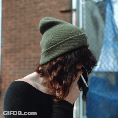 Woman In Green Beanie Holding Cigarette GIF