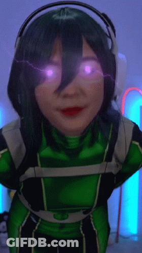 Woman In Green Costume And Headphones With Purple Eyes GIF