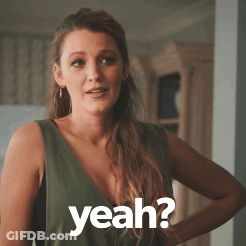 Woman In Green Dress Asking Yeah GIF
