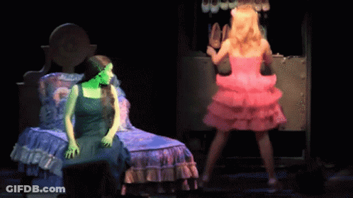 Woman In Green Dress Beside Woman In Pink GIF