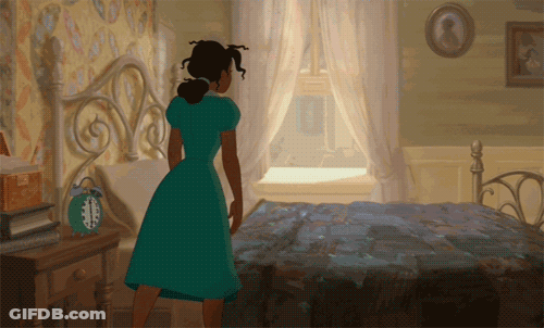 Woman In Green Dress By Bed With Alarm Clock GIF