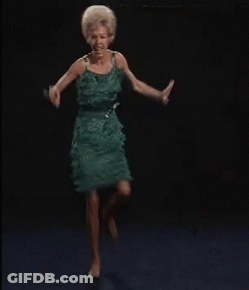 Woman In Green Dress Crazy Dancing GIF