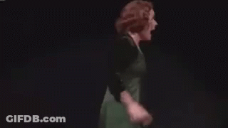 Woman In Green Dress Dancing On Stage GIF