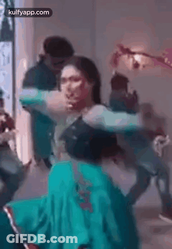 Woman In Green Dress Dancing With Man GIF