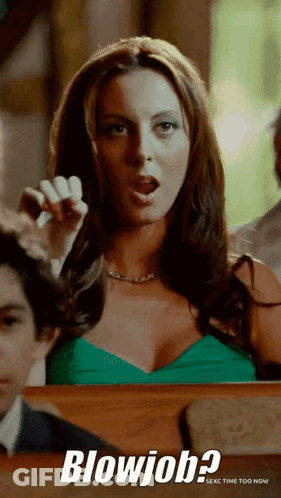 Woman In Green Dress Giving Blowjob GIF