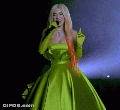 Woman In Green Dress Holding Microphone GIF