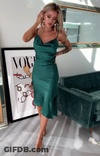 Woman In Green Dress In Front Of Vogue GIF