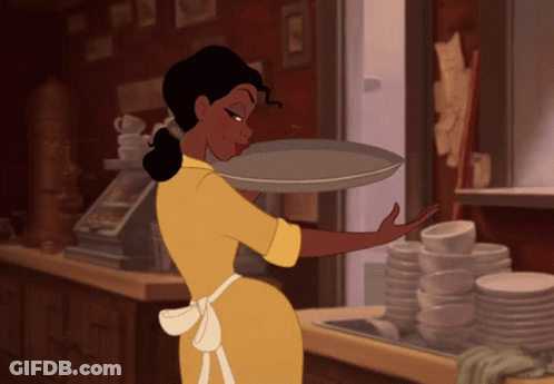 Woman In Green Dress Next To Bed GIF