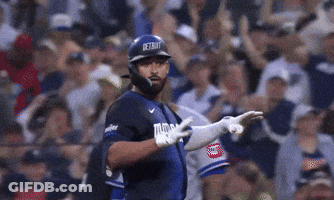 Woman In Green Dress Smiling With Arm Around Waist GIF