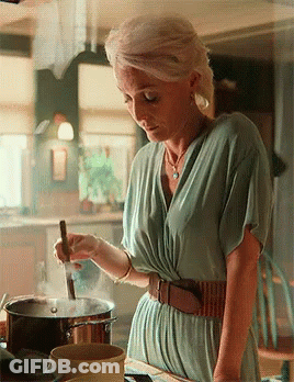 Woman In Green Dress Stirring Pot GIF