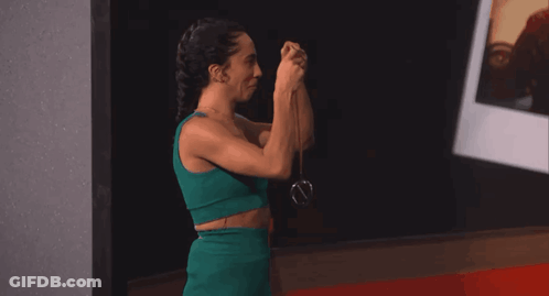 Woman In Green Dress Taking Selfie GIF