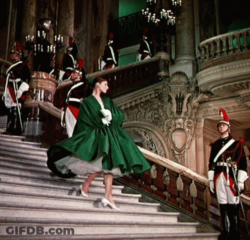 Woman In Green Dress Walking Down Stairs GIF