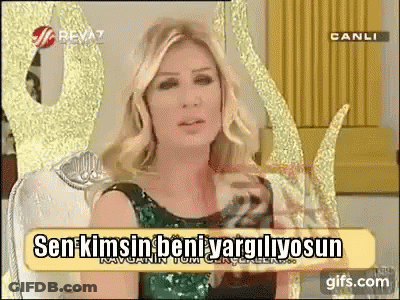 Woman In Green Dress With Sign Sen Kimsin Beni Vargilyosun GIF