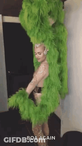 Woman In Green Feather Boa GIF