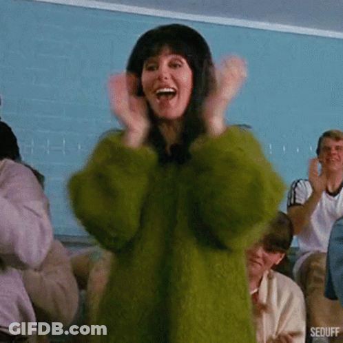 Woman In Green Fur Coat Clapping GIF