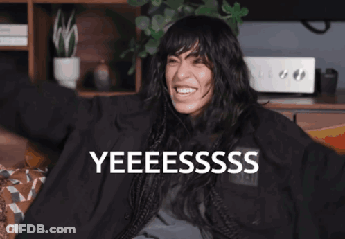 Woman In Green Fur Coat Singing GIF