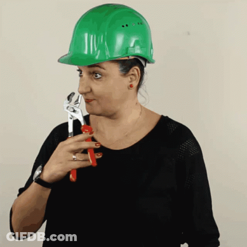 Woman In Green Hard Hat Holding Wrench GIF