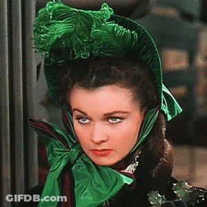 Woman In Green Hat And Scarf GIF