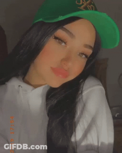 Woman In Green Hat And White Hoodie 2019 GIF