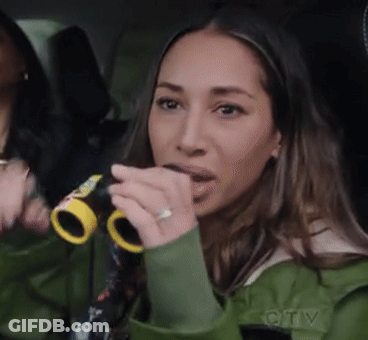 Woman In Green Jacket Holding Binoculars GIF