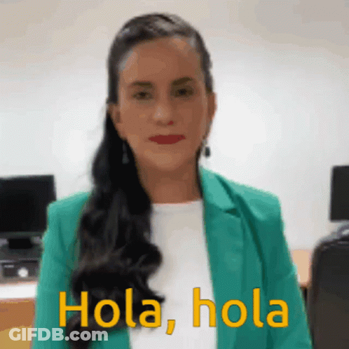 Woman In Green Jacket Says Hola Hola GIF