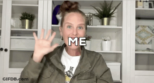 Woman In Green Jacket Waving GIF