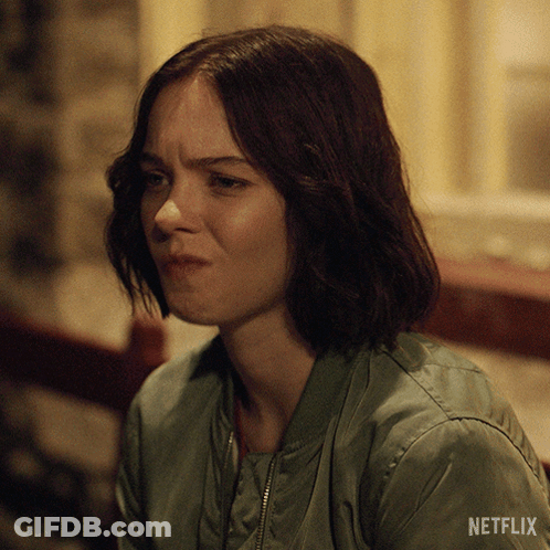 Woman In Green Jacket With Netflix Logo GIF