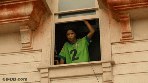 Woman In Green Jersey Looking Out Window GIF