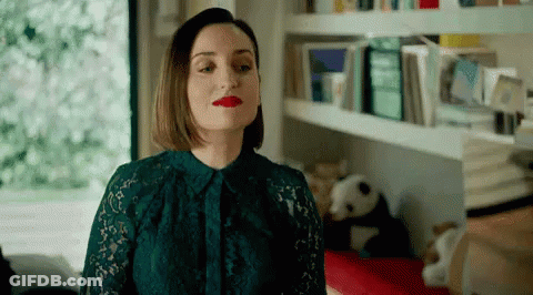 Woman In Green Lace Dress And Red Lipstick Standing In Room GIF