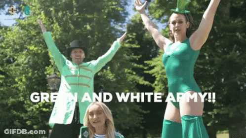 Woman In Green Leotard Next To Man In Jacket And Top Hat GIF