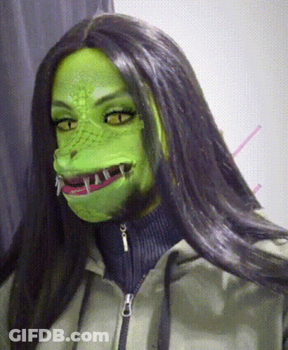 Woman In Green Mask With Sharp Teeth GIF