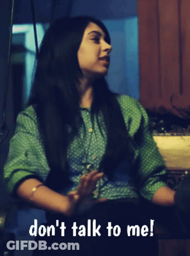 Woman In Green Polka Dot Shirt Says Don't Talk To Me GIF