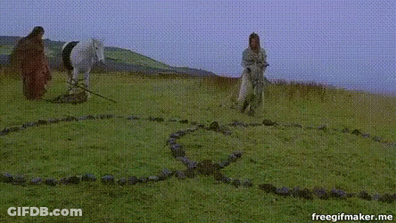 Woman In Green Robe Standing In Field GIF