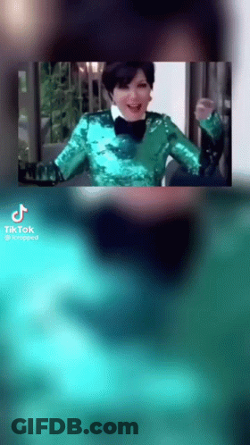 Woman In Green Sequined Jacket And Bow Tie Smiling GIF