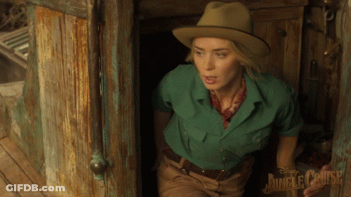 Woman In Green Shirt And Hat At Jungle Cruise Doorway GIF