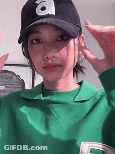 Woman In Green Shirt And Hat With Letter A GIF