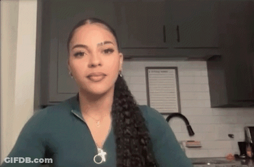 Woman In Green Shirt And Ponytail GIF