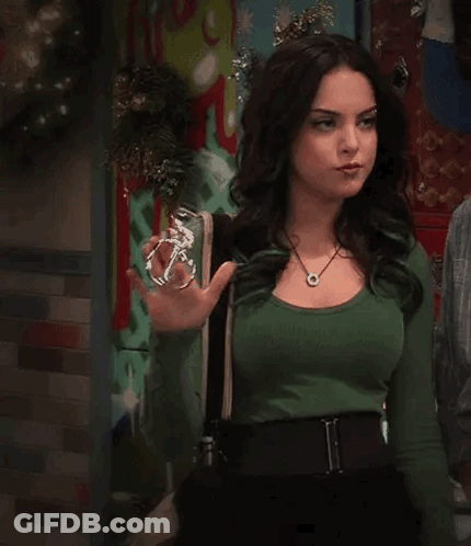 Woman In Green Shirt Holding Glass Bottle GIF