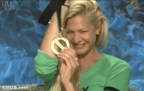 Woman In Green Shirt Holding Medal GIF