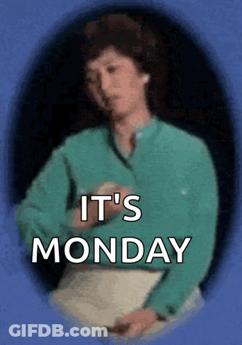 Woman In Green Shirt Holding Paper Saying It's Monday GIF