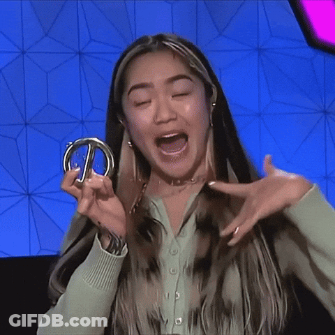 Woman In Green Shirt Holding Silver Ring GIF
