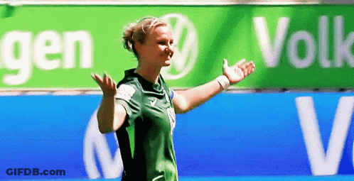 Woman In Green Shirt In Front Of VW Sign GIF