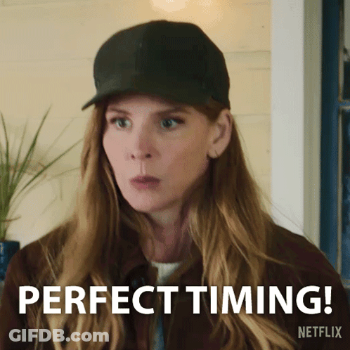 Woman In Green Shirt Making Clumsy Sign GIF