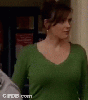 Woman In Green Shirt Next To Man GIF