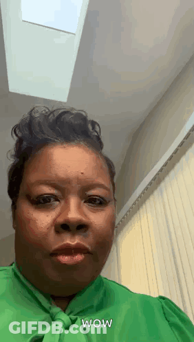 Woman In Green Shirt Saying Wow GIF