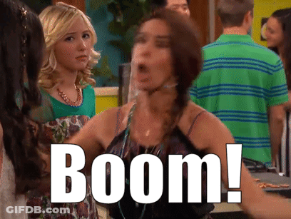 Woman In Green Shirt Says Boom GIF