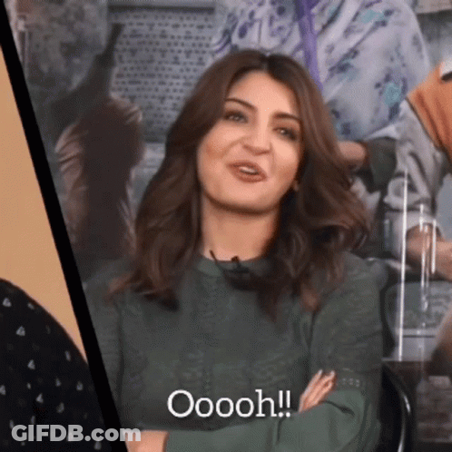 Woman In Green Shirt Smiling Oooh GIF